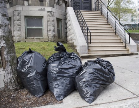 Workers sorting commercial recycling at a collection point